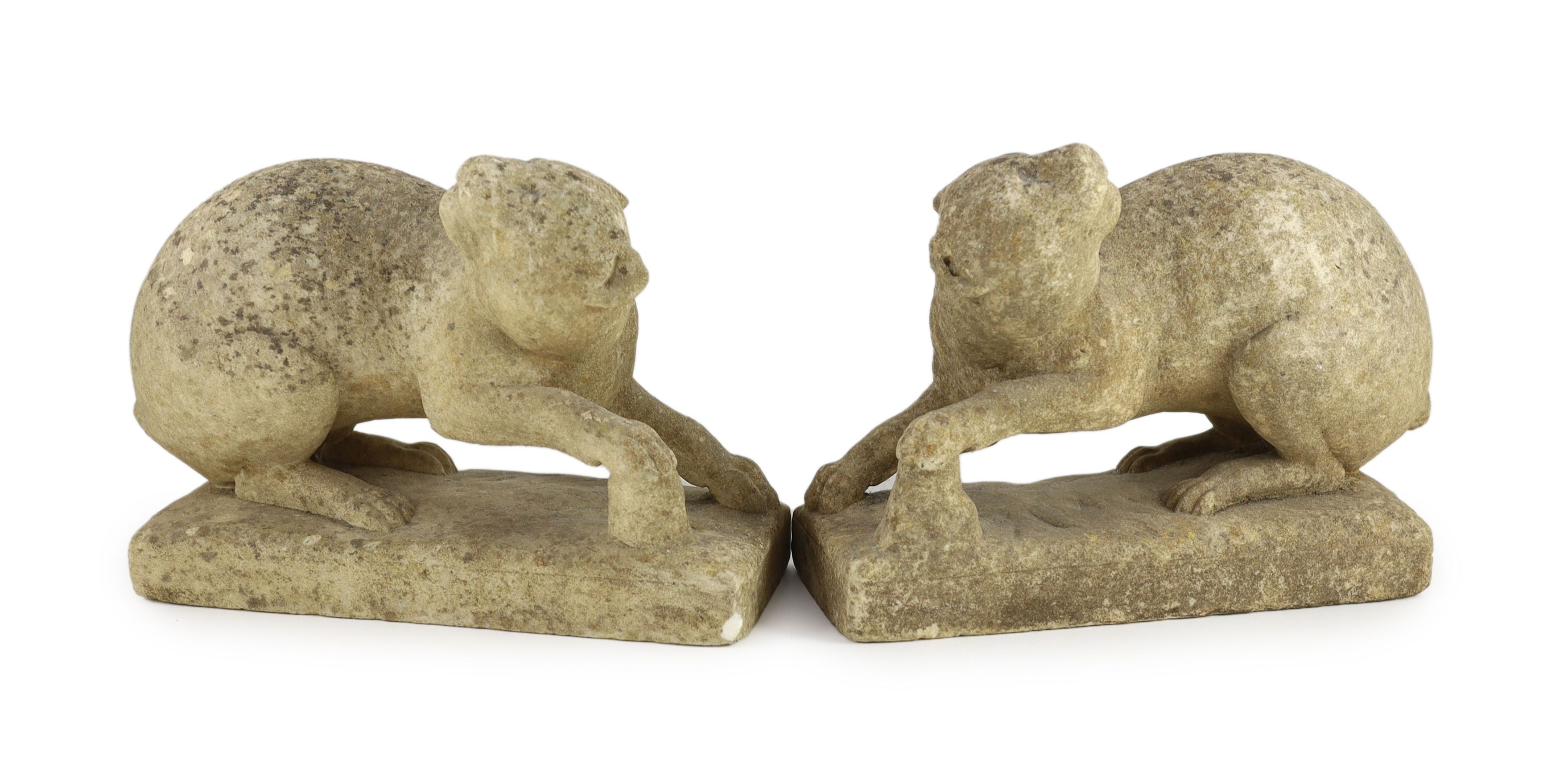 A pair of 19th century carved marble models of crouching cats, width 32cm, depth 12cm, height 22cm